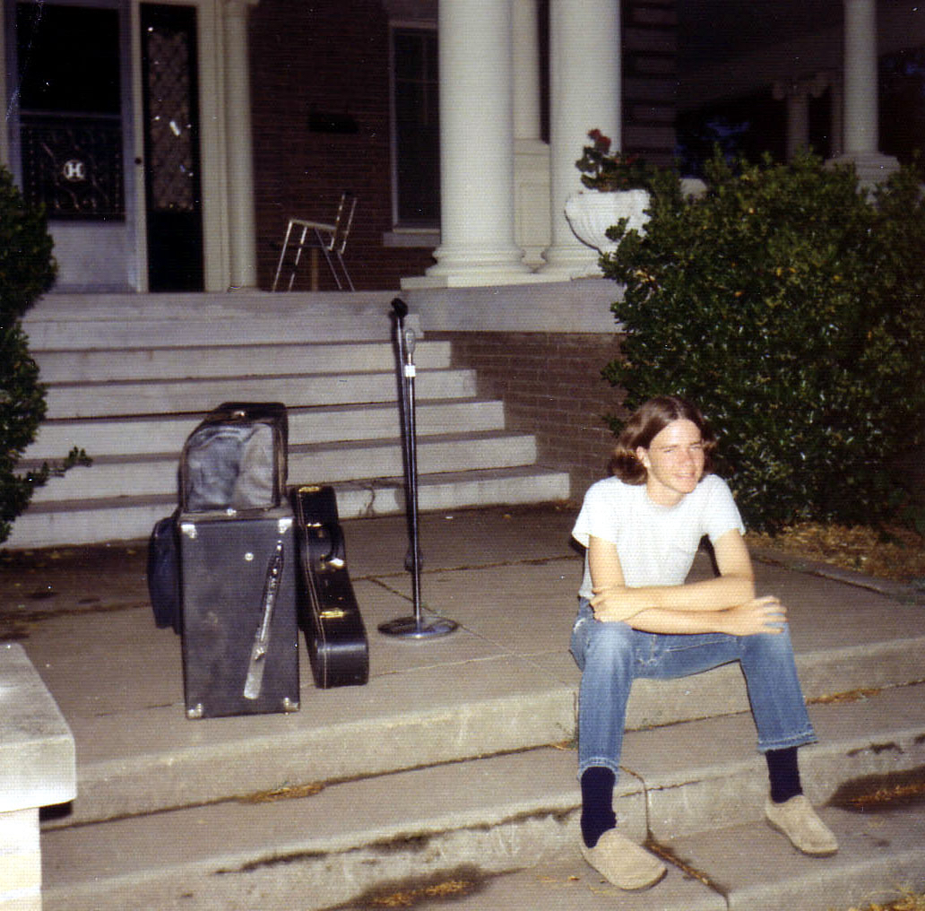 Michael sitting on steps at home in Enid