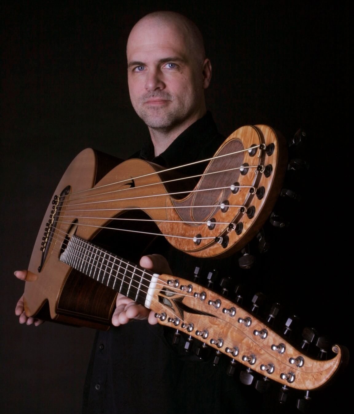 headshot of Jeff Titus with harp guitar