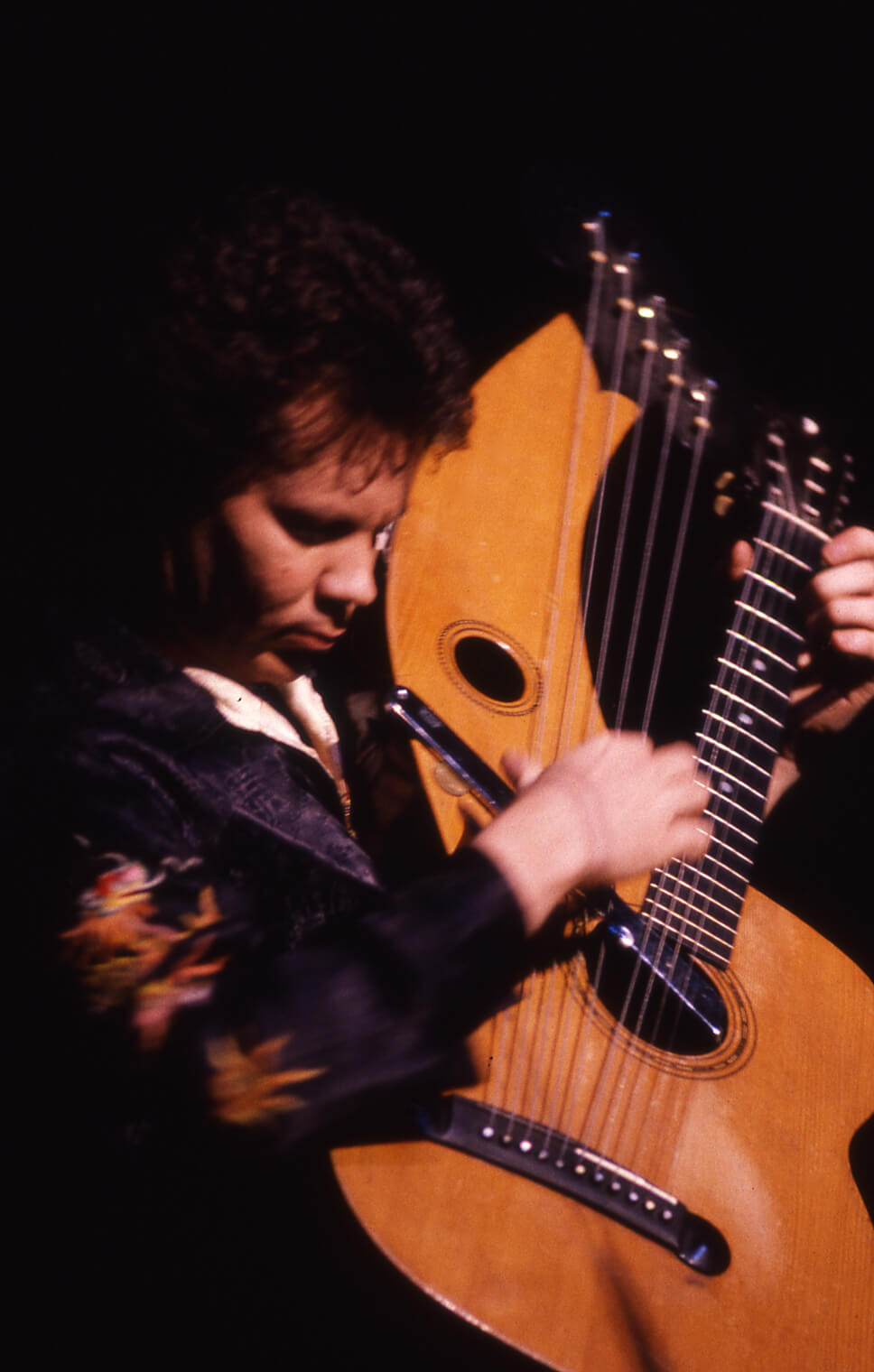 Michael Hedges playing the harp guitar in concert