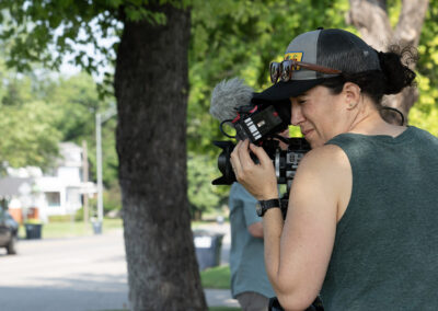 Director of Photography Clare Major prepares for interview outside of Michael's family home in Enid, OK. Photo credit: Brian Malone.